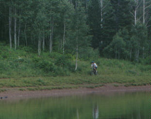 Biker rides past Dog Lake