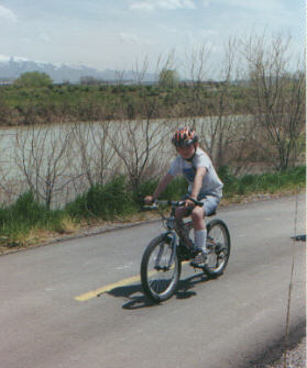 Alex, age 8, rides the trail